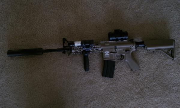 Yep, you guessed it - My G&G Combat Machine Suppressed with a RDS, Vertical Foregrip, and a laser and flashlight in one.